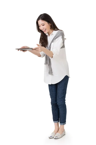 Attractive young Asian woman using pad — Stock Photo, Image