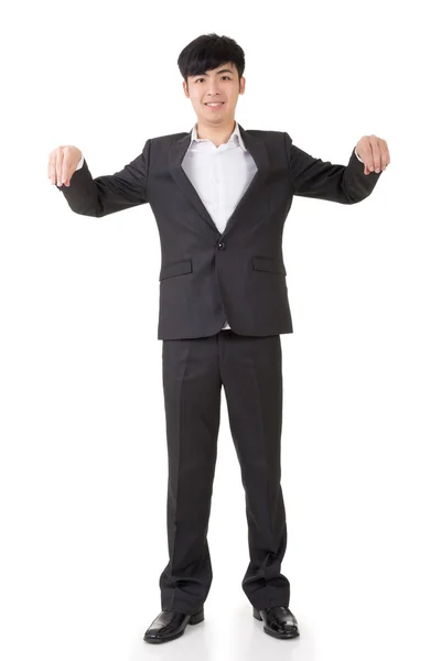 Young asian businessman holding something — Stock Photo, Image