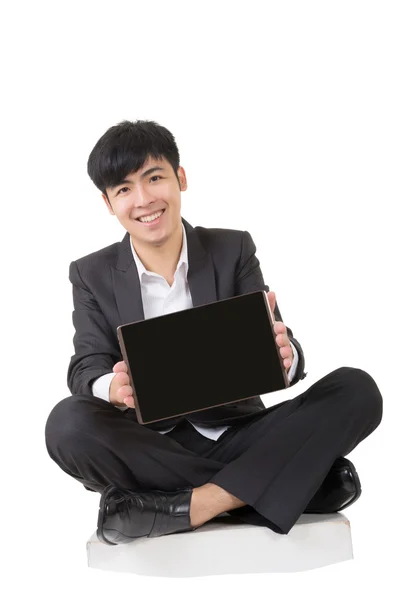 Asian businessman sit and hold pad — Stock Photo, Image