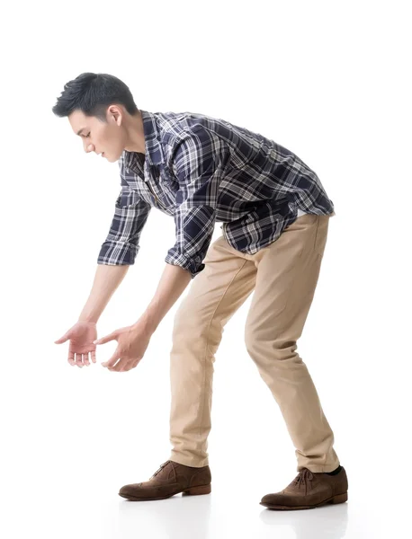 Asian young guy carry or take something — Stock Photo, Image