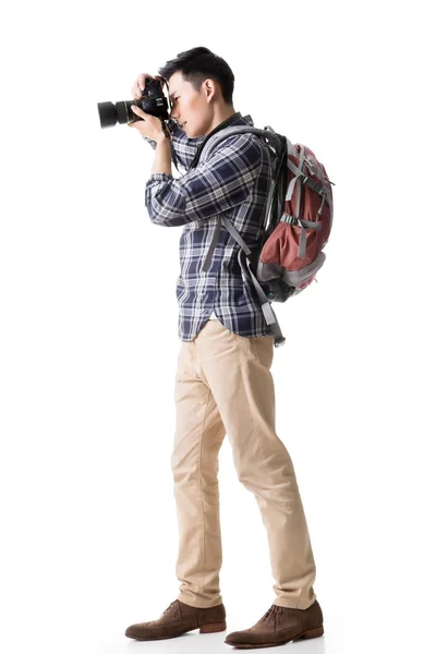 Asian young male backpacker take a picture — Stock Photo, Image