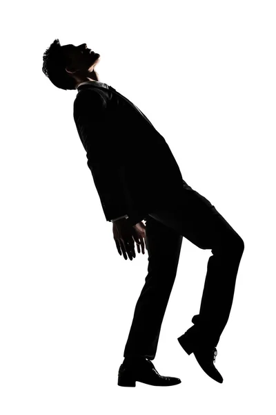 Silhouette of Asian businessman dancing or posing — Stock Photo, Image