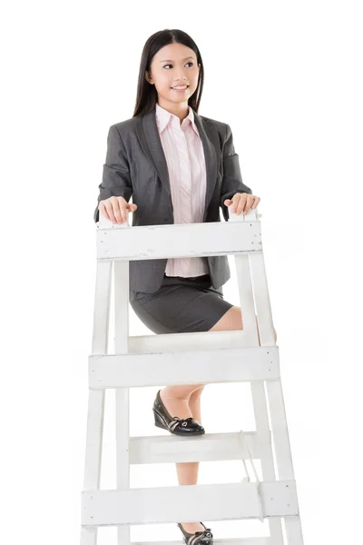 Asian business woman climb a ladder — Stock Photo, Image