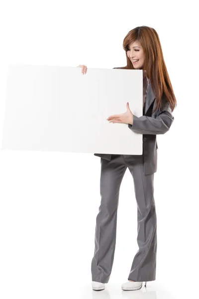 Asian business woman holding a blank board — Stock Photo, Image