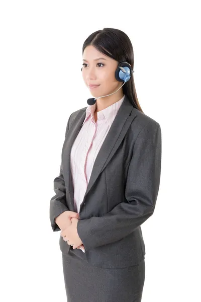 Attractive young business woman with a headphone — Stock Photo, Image