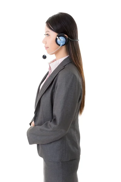 Attractive young business woman with a headphone — Stock Photo, Image