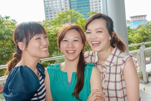 Asian woman with friends — Stock Photo, Image