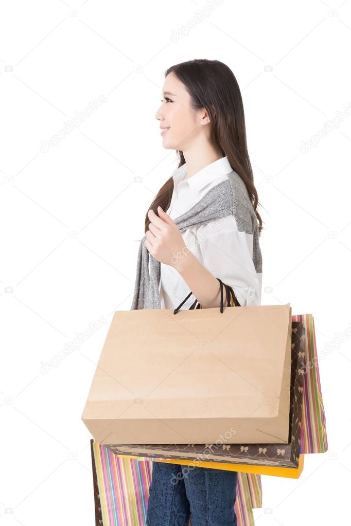 Attractive asian woman holding shopping bags