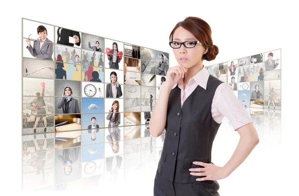 Woman standing in front of TV — Stock Photo, Image