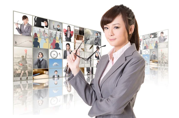 Woman standing in front of TV — Stock Photo, Image