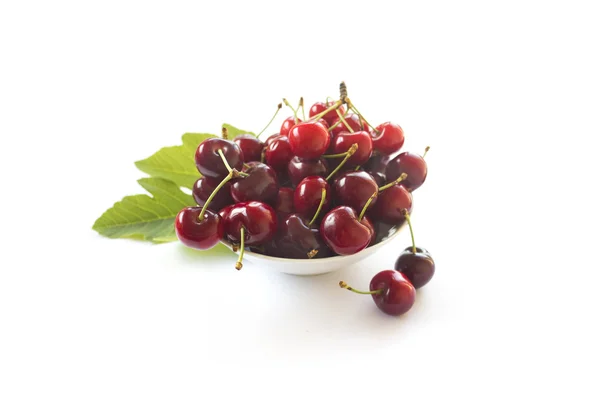 Cherries in a bowl on white — Stock Photo, Image