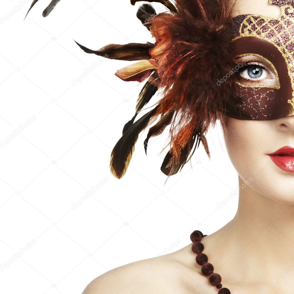 Beautiful young woman in brown mysterious venetian mask