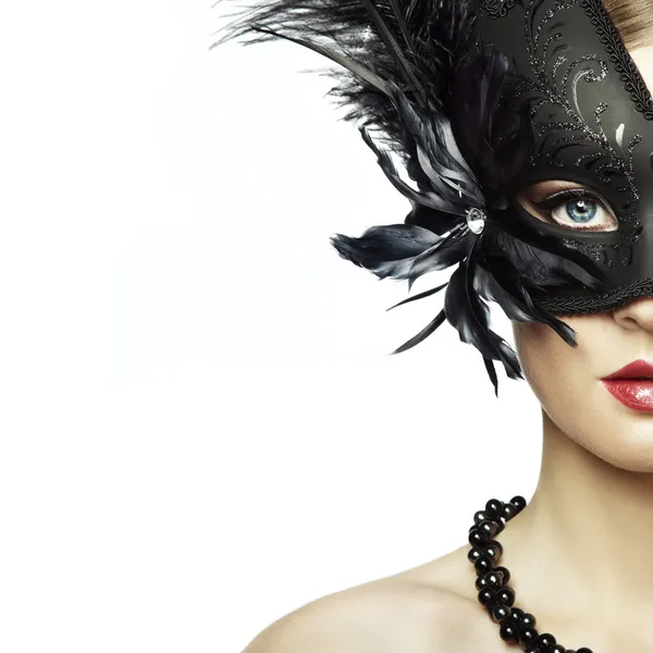 Beautiful young woman in black mysterious venetian mask — Stock Photo, Image