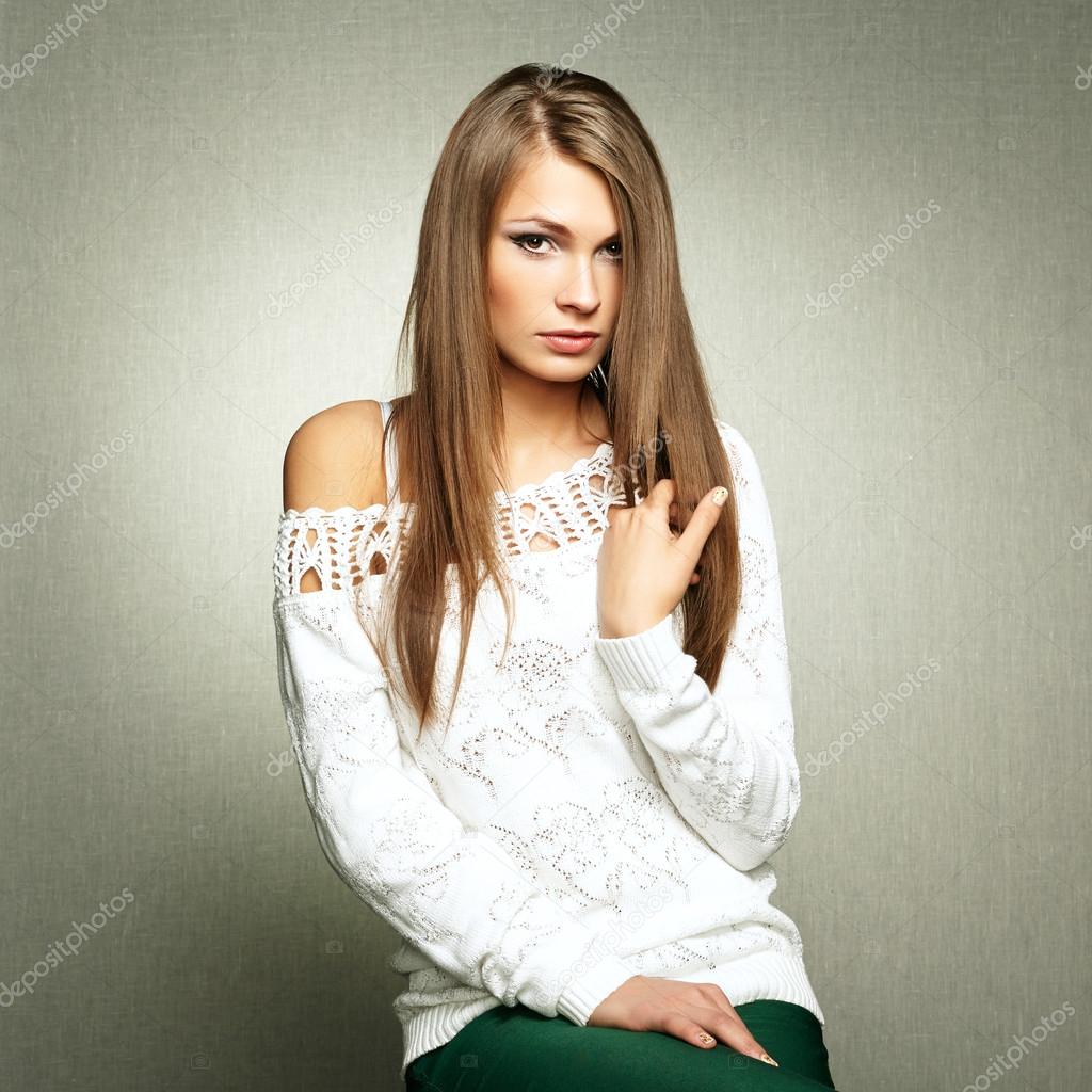 Photo of beautiful young woman in white jacket