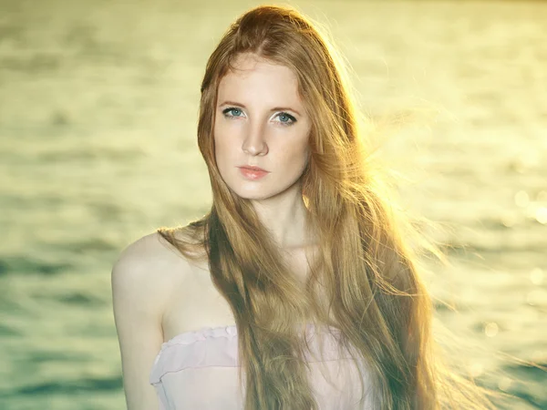 Beautiful redhead girl at pond — Stock Photo, Image