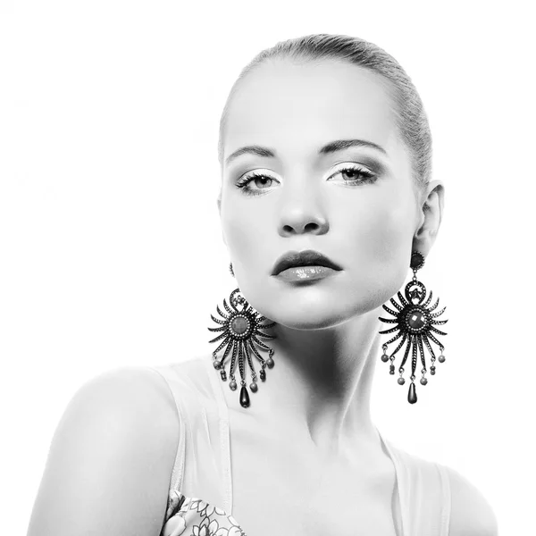 Portrait of beautiful young woman with earring — Stock Photo, Image