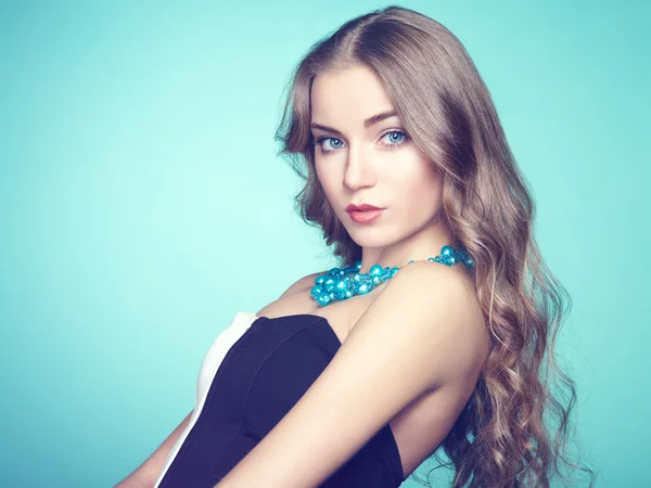 Portrait of beautiful young blonde girl in black dress — Stock Photo, Image