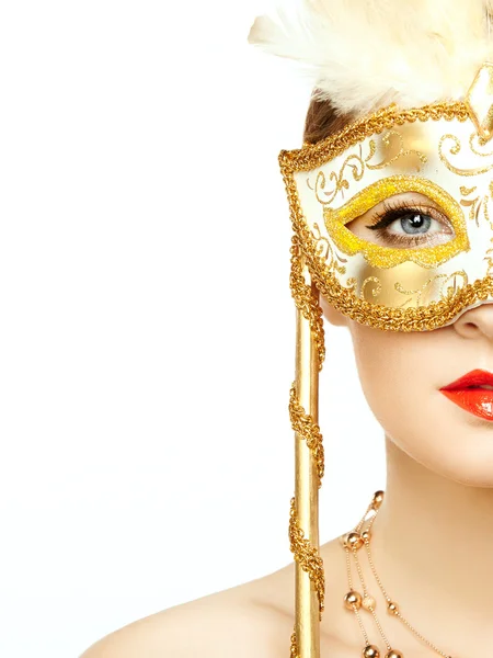 Beautiful young woman in mysterious golden Venetian mask — Stock Photo, Image