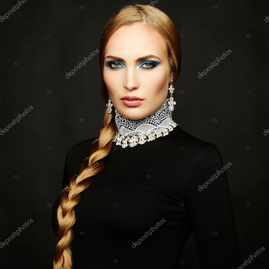 Photo of beautiful woman with magnificent hair. Perfect makeup. Fashion photo