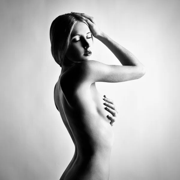 Fashion photo of beautiful nude woman. Black and white Stock Image