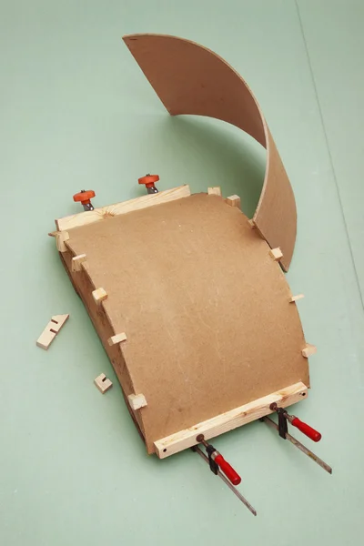 Gluing the workpiece of hardboard using patterns — Stock Photo, Image