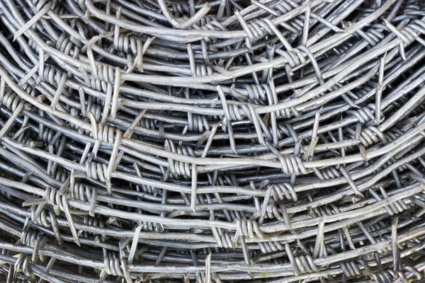 Barbed wire as a background — Stock Photo, Image