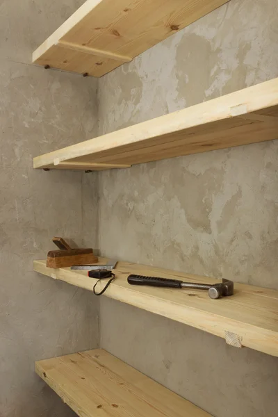 Solid shelves made of wood in rural pantry — Stock Photo, Image