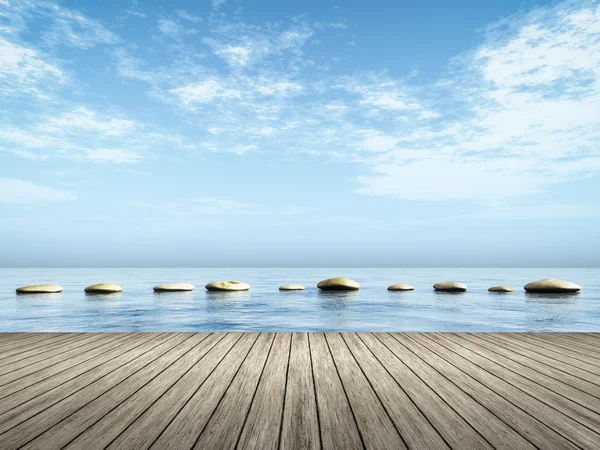 Steg stenar i det blå havet — Stockfoto