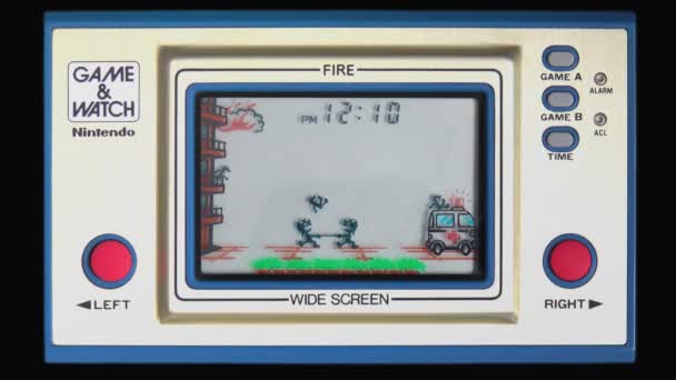 Original Nintendo Game Watch Fire Front View Screen Clock Animation — Stock Video
