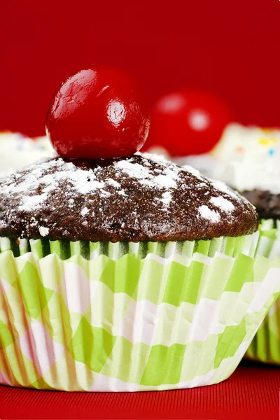 Cute cupcake with maraschino cherry — Stock Photo, Image