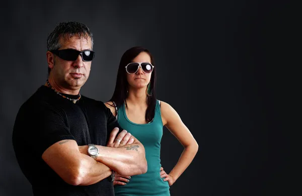 Tough guy with biker chick — Stock Photo, Image