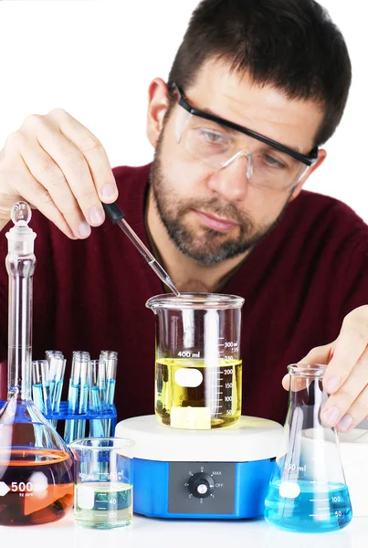 Scientist mixing chemicals — Stock Photo, Image