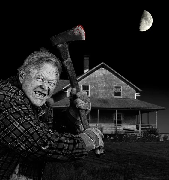 Crazy axeman and old cedar shingle house — Stock Photo, Image