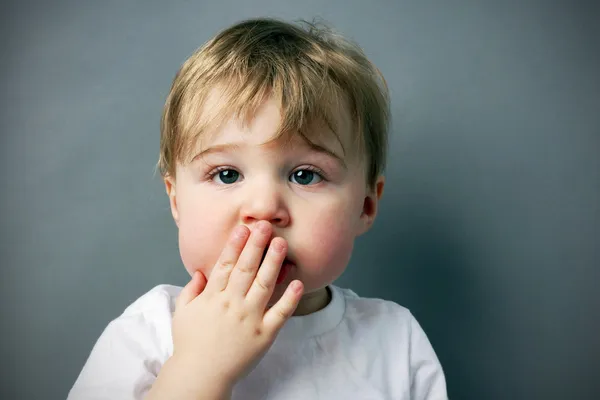 Blond boy with pardon me face — Stock Photo, Image