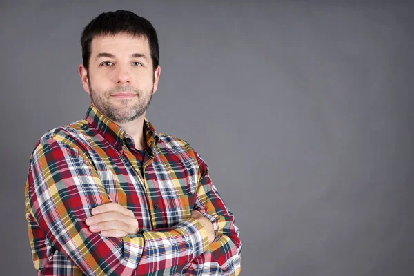 Confident man on grey — Stock Photo, Image