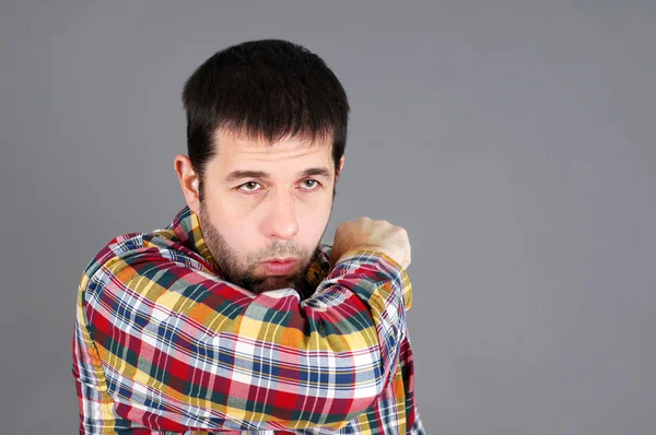 Man coughing in elbow — Stock Photo, Image