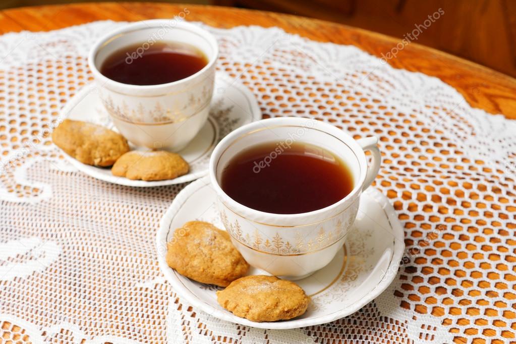 Two tea cups with gold