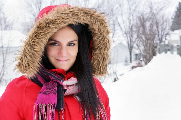 Portrait of young woman with red winter coat — Stock Photo, Image