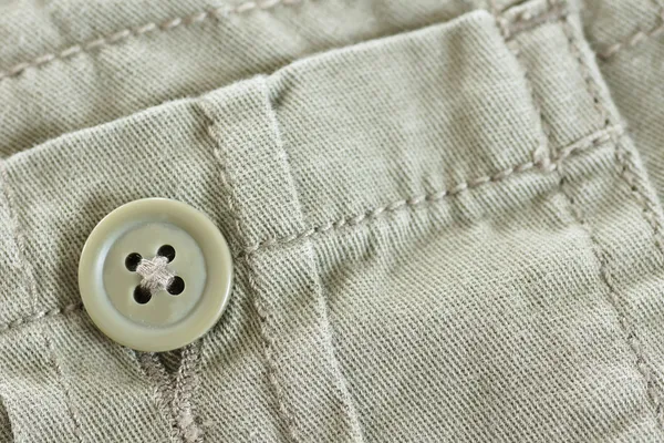 Кнопка в кармане Хаки — стоковое фото