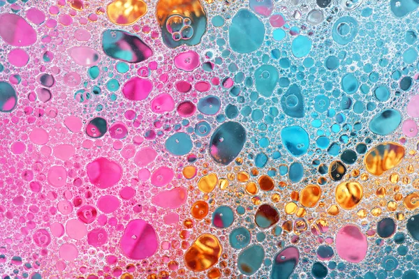 Aceite y agua sobre los colores —  Fotos de Stock