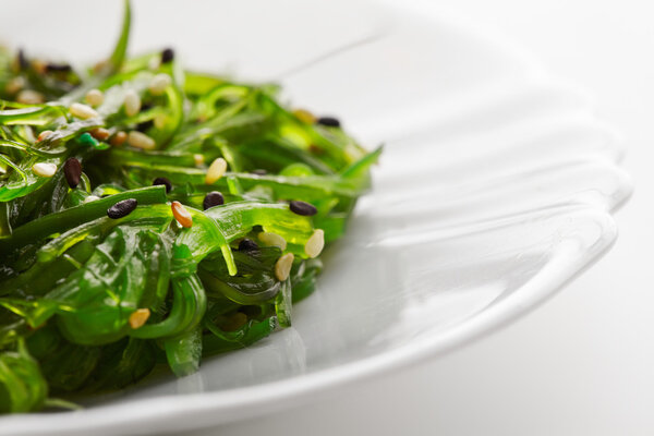 Japanese cuisine , seaweed salad in white plate. Healthy organic sea food