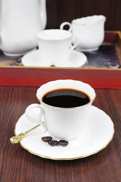 Coffee in white porcelain cup — Stock Photo, Image