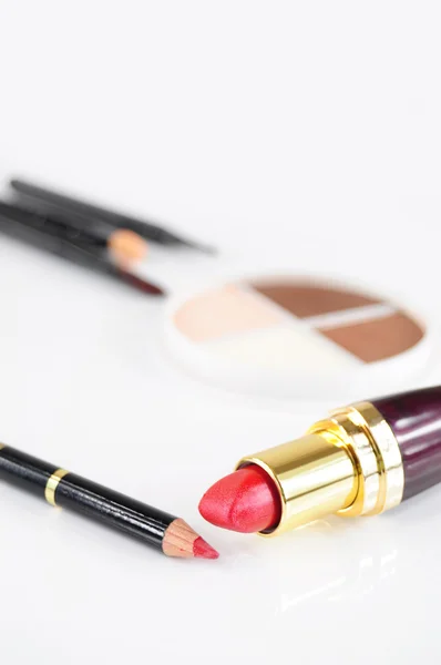 Lipstick and pencil in red — Stock Photo, Image