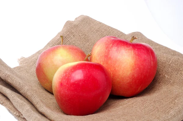 Apples on sackcloth — Stock Photo, Image