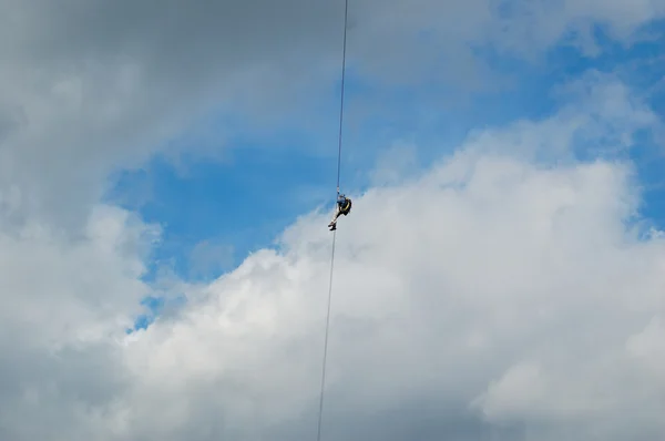 Alpinist in blue sky — Stock Photo, Image