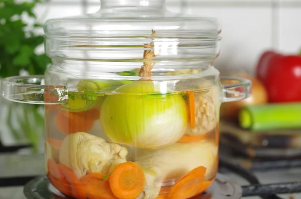 Soup in glass pot — Stock Photo, Image