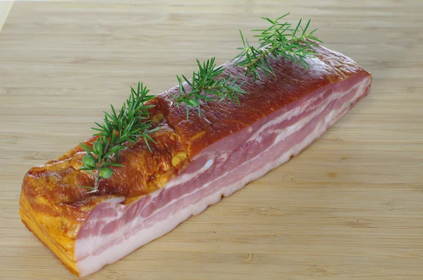 Smoked bacon with juniper — Stock Photo, Image