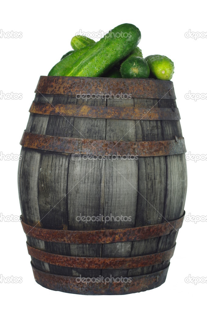 old wooden barrel with cucumbers