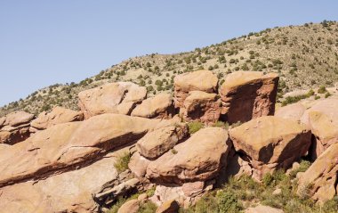 Red Boulders on Desert Hillside clipart