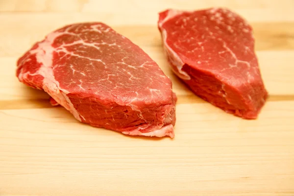 Two Filet Mignon Steaks on Wood Cutting Board — Stock Photo, Image